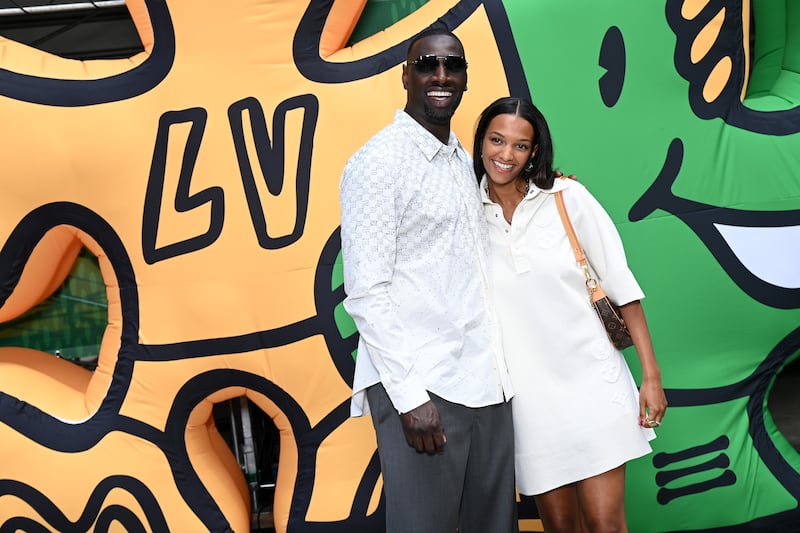 French actor Omar Sy and daughter Selly Sy attend the Louis Vuitton show. Getty Images For Louis Vuitton