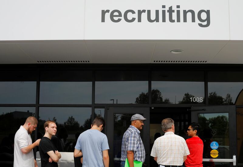 Job seekers line up to apply during "Amazon Jobs Day," a job fair being held at 10 fulfillment centers across the United States aimed at filling more than 50,000 jobs, at the Amazon.com Fulfillment Center in Fall River, Massachusetts, U.S., August 2, 2017.   REUTERS/Brian Snyder