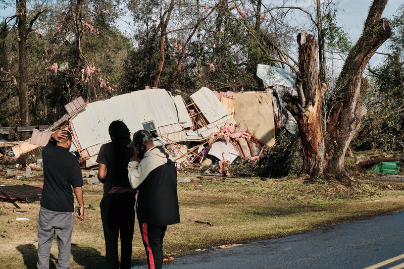 People look at a mobile home destroyed by the tornado in Mount Vernon. EPA