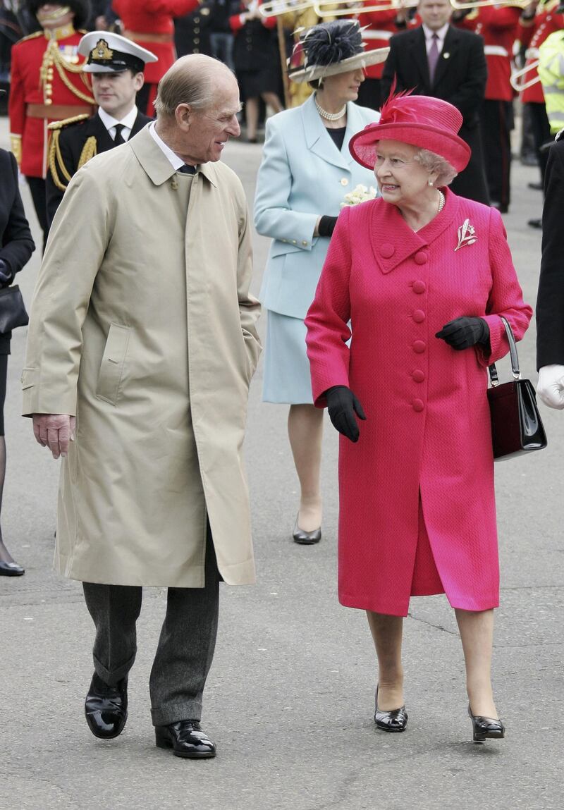WINDSOR, UNITED KINGDOM - APRIL 21:  Queen Elizabeth II and Prince Philip, Duke of Edinburgh smile at each other on April 21, 2006 in Windsor, England. HRH Queen Elizabeth II is taking part in her traditional walk in the town to celebrate her 80th Birthday. In the evening the Prince of Wales will host a private party for The Queen and other members of the Royal family at Kew Palace.  (Photo by MJ Kim/Getty Images)