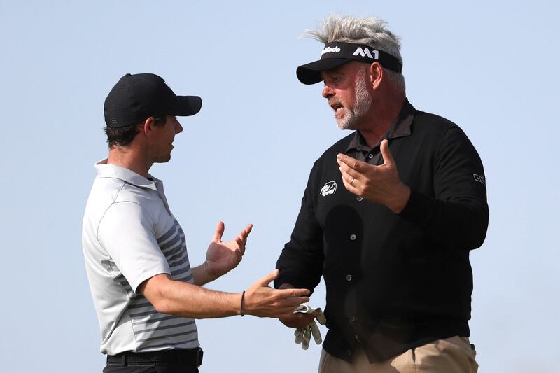 Northern Ireland's Rory McIlroy, left, and Darren Clarke, talk on the 9th hole during a practice round ahead of the British Open Golf Championship, at Royal Birkdale, Southport, England Tuesday, July 18, 2017. (AP Photo/Peter Morrison)