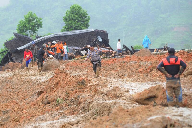 Indonesian villigers and rescuers search for landslide victims at Sirnaresmi village in Sukabumi, Indonesia. EPA