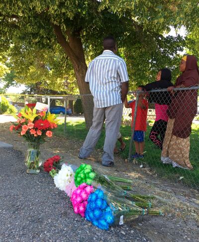 Flowers from well-wishers are left just outside a Boise, Idaho, apartment complex, Sunday, July 1, 2018, where nine people were stabbed in a knife attack the night before. (AP Photo/Rebecca Boone)