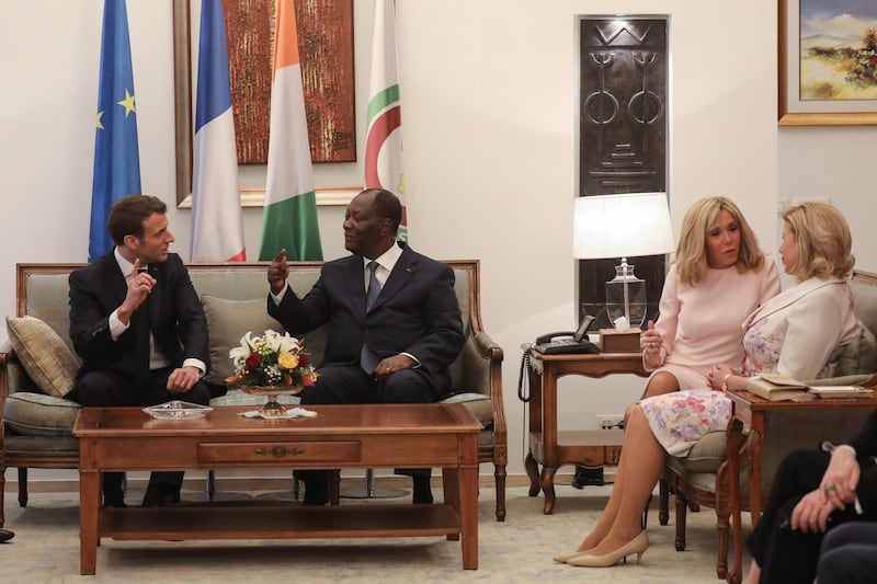 The Macrons meet Ivory Coast's President Alassane Ouattara and Ivorian First Lady Dominique Ouattara.  AFP