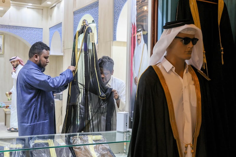 Al-Salem store in Doha's Souq Waqif supplied the bisht worn by Lionel Messi after the World Cup final. AFP