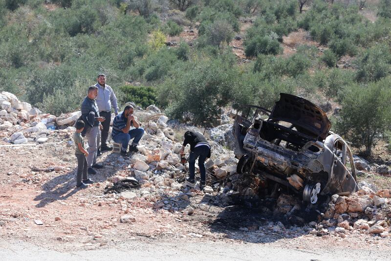 A burnt-out car in Qarawa in the occupied West Bank, where attacks by illegal Israeli settlers on Palestinians are on the rise. EPA