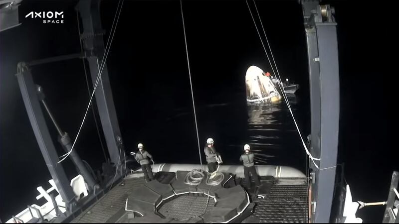 The capsule being pushed towards the rescue boat