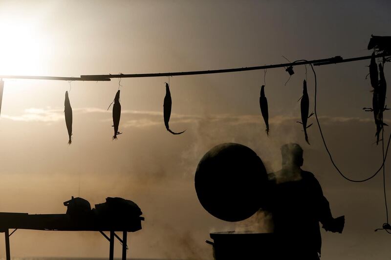 A Palestinian street vendor prepares corn before breaking the fast at sunset during Ramadan, in Gaza City. AFP