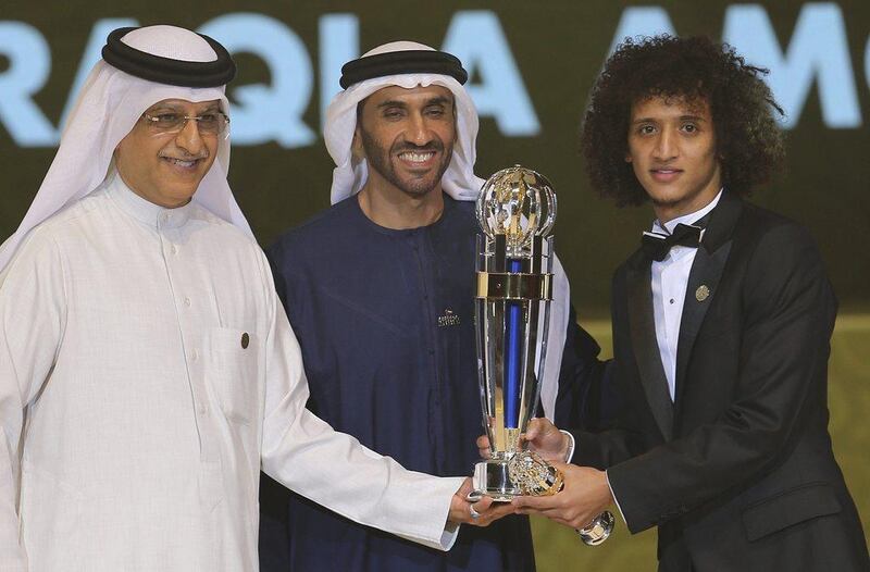 Omar Abdulrahman, right, receives the AFC player of year award from Sheikh Nahyan bin Zayed Al Nahyan. Kamran Jebreili / AP Photo