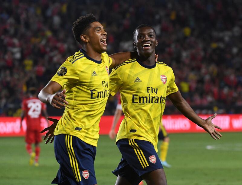 Forward Eddie Nketiah of Arsenal (R) celebrates with teammate Tyreece John-Jules (L) after scoring the winning goal against Bayern Munich during their International Champions Cup football match at the Dignity Health Stadium in Carson, California on July 17, 2019.   / AFP / Mark RALSTON

