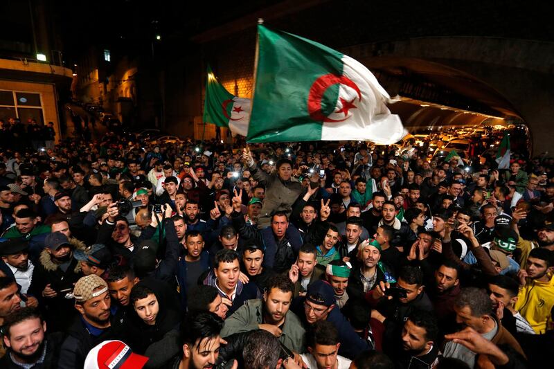 A crowd celebrates after ailing Algerian President Abdelaziz Bouteflika resigned. AP Photo
