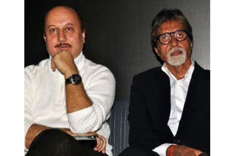 The actors Anupam Kher, left, and Amitabh Bachchan. The former has just unveiled his life-coaching book, The Best Thing About You Is You. AFP