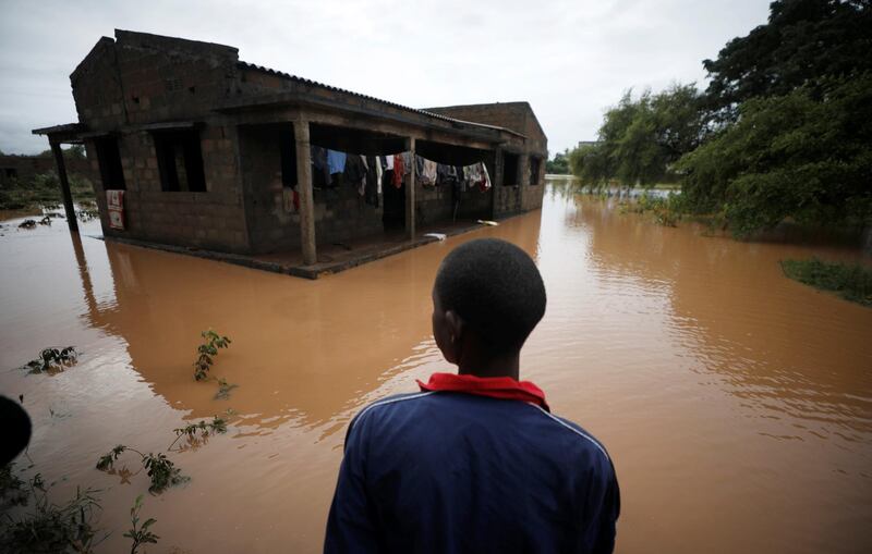 Agiro Cavanda looks at his flooded home in the aftermath of Cyclone Kenneth, at Wimbe village in Pemba, Mozambique, April 29, 2019. REUTERS/Mike Hutchings