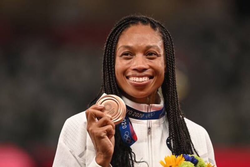 Bronze medallist USA's Allyson Felix celebrates on the podium during the medal ceremony for the women's 400m event. Getty