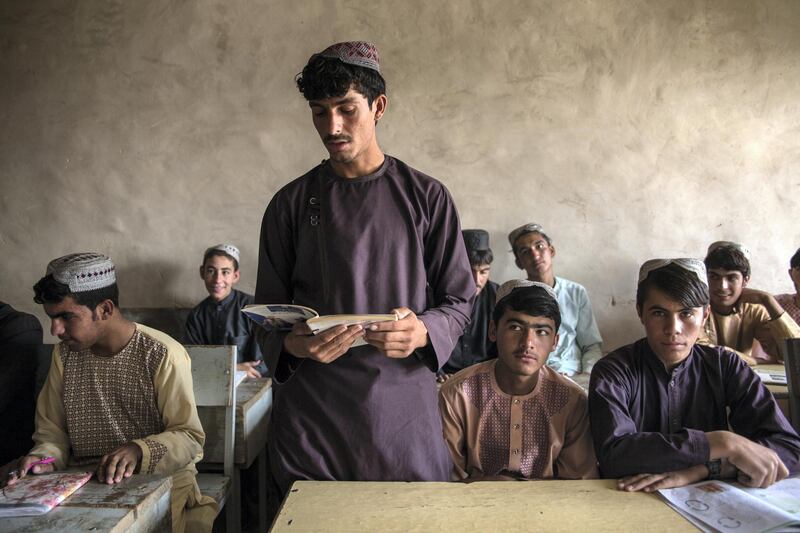 Khalil, 20, stands in the school building he constructed three years ago in Afghanistan's Kandahar province. Stefanie Glinski for The National