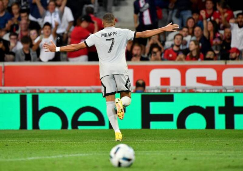 Paris Saint-Germain's French forward Kylian Mbappe wheels away in celebration after scoring his team's seventh goal. AFP