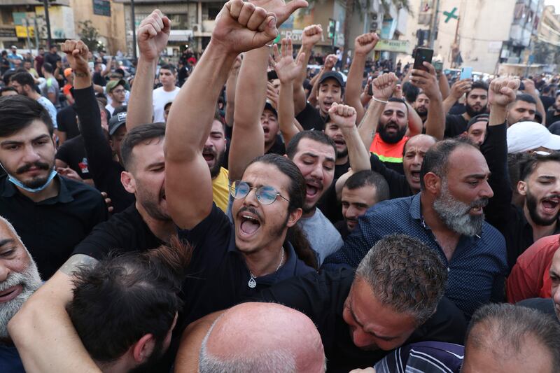 Supporters of Hezbollah chant slogans during a funeral procession in the southern Beirut suburb of Dahiyeh. AP Photo