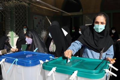 An Iranian woman casts her vote during presidential elections at a polling station in Tehran, Iran June 18, 2021. Majid Asgaripour/WANA (West Asia News Agency) via REUTERS ATTENTION EDITORS - THIS IMAGE HAS BEEN SUPPLIED BY A THIRD PARTY.