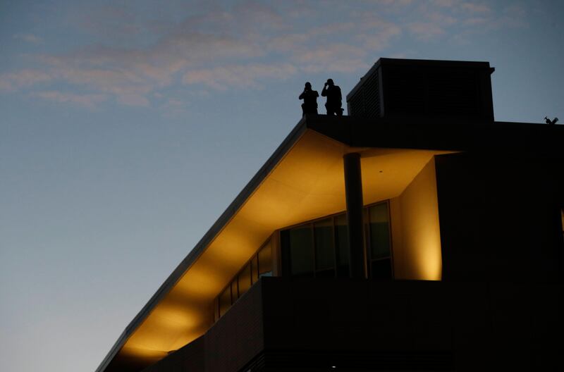 Police perched on top of a roof of the University of California Berkeley campus in California. John G Mabanglo / EPA