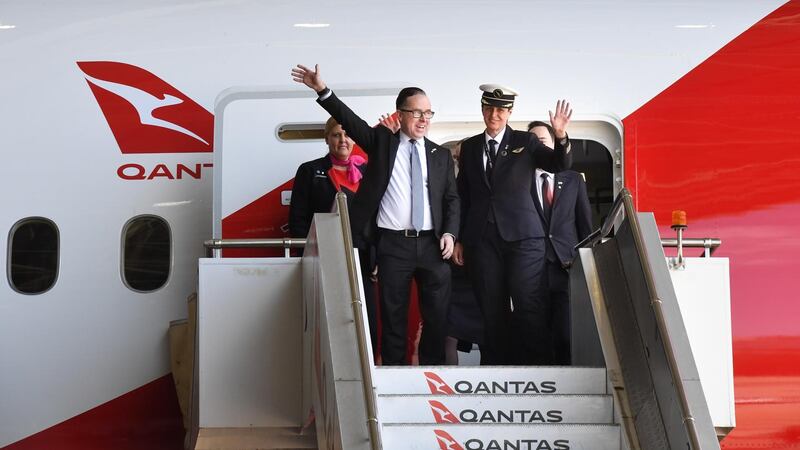 Qantas CEO Alan Joyce, left, and crew members of flight QF7879 disembark in Sydney, Australia after successfully flying direct from London to Sydney in 19-and-a-half hours.  EPA