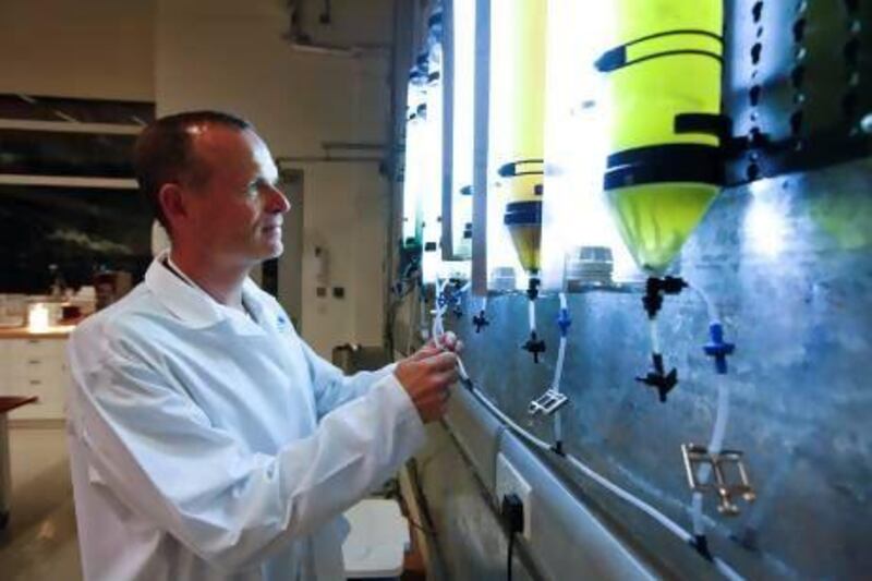 Jens Ejbye Schmidt, a professor in biofuels in the chemical engineering programme at Masdar Institute, demonstrates how to convert organic waste into fuel. Sarah Dea / The National