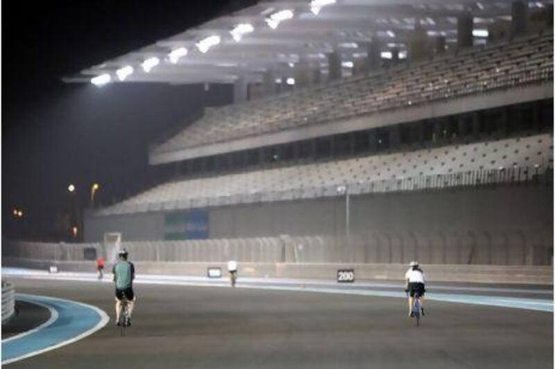 Away from the traffic on the capital's streets, cyclists take part in an open cycle night at Abu Dhabi's Yas Marina Circuit.