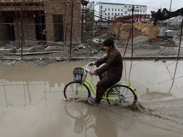 Dirty water floods the streets in Kabul. Mahab Azizi for The National