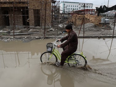 Dirty water floods the streets in Kabul. Mahab Azizi for The National
