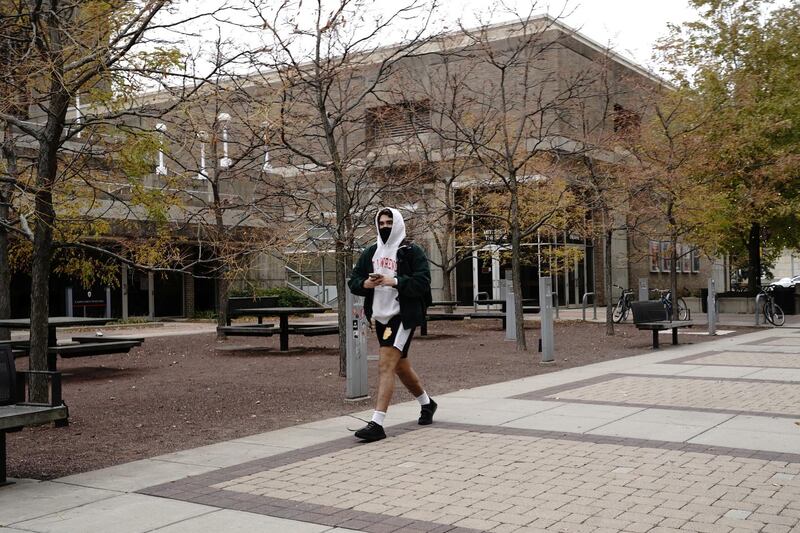A student wearing a protective mask walks on the campus of the University of Wisconsin-Madison, as the coronavirus outbreak continues in Madison, Wisconsin, US. Reuters