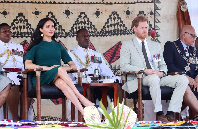 Britain's Prince Harry and Meghan, Duchess of Sussex, attend a ceremony at Nadi airport. Reuters