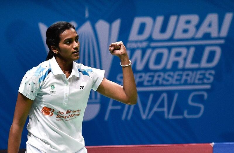 PV Sindhu celebrates after winning against Carolina Marin in their final group match on Friday in Dubai. Stringer / AFP / December 16, 2016