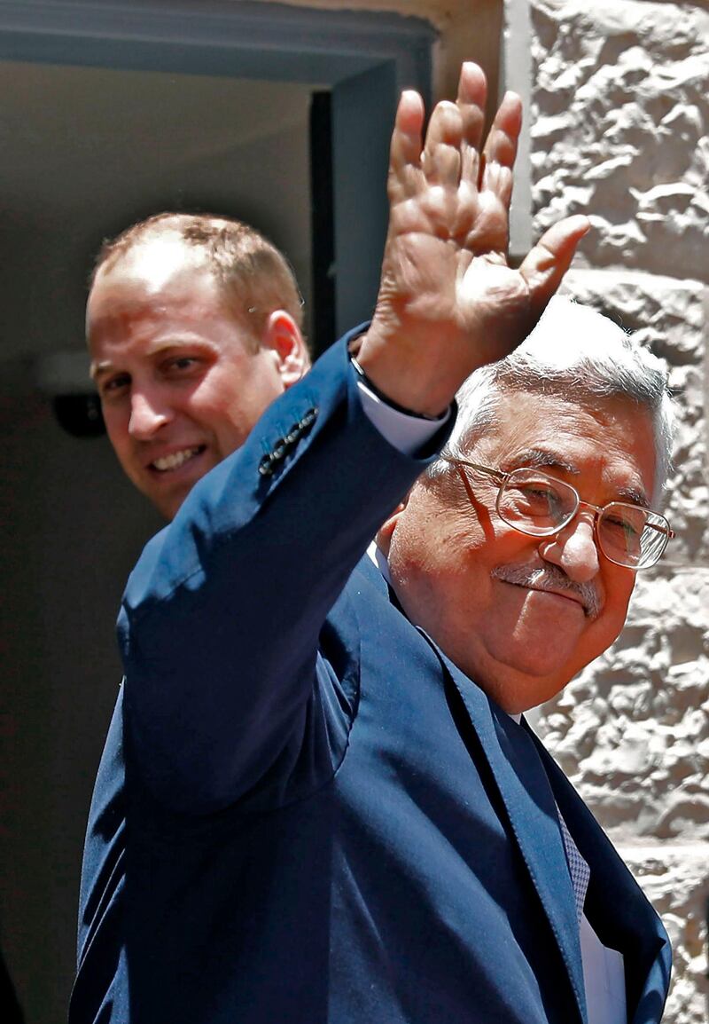 Palestinian president Mahmud Abbas gestures as he receives Britain's Prince William in the West Bank city of Ramallah. Ahmad Gharabli / AFP