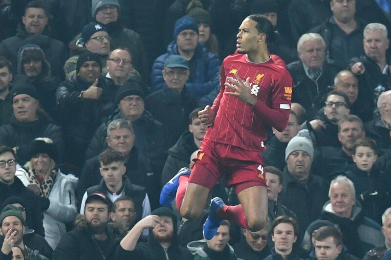 Liverpool's Dutch defender Virgil van Dijk celebrates scoring the opening goal during the English Premier League football match between Liverpool and Manchester United at Anfield stadium in Liverpool, north west England on January 19, 2020. (Photo by Paul ELLIS / AFP) / RESTRICTED TO EDITORIAL USE. No use with unauthorized audio, video, data, fixture lists, club/league logos or 'live' services. Online in-match use limited to 120 images. An additional 40 images may be used in extra time. No video emulation. Social media in-match use limited to 120 images. An additional 40 images may be used in extra time. No use in betting publications, games or single club/league/player publications. / 