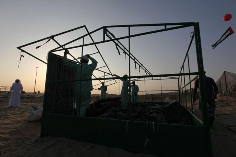 DUBAI , UNITED ARAB EMIRATES  Ð  Nov 28 : Workers from Dubai Municipality demolishing the winter camps which are without permit in Al Mushrif area in Dubai. ( Pawan Singh / The National ) For News. Story by Mohammed Al Khan