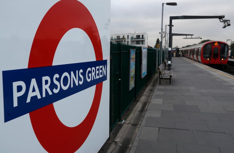 A train pulls in to the platform at Parsons Green tube station in London, Monday, Sept. 18, 2017. A bucket wrapped in an insulated bag caught fire on a packed London subway train at Parsons Green station on Friday Sept. 15, police are treating it as a terrorist incident. (AP Photo/Kirsty Wigglesworth)