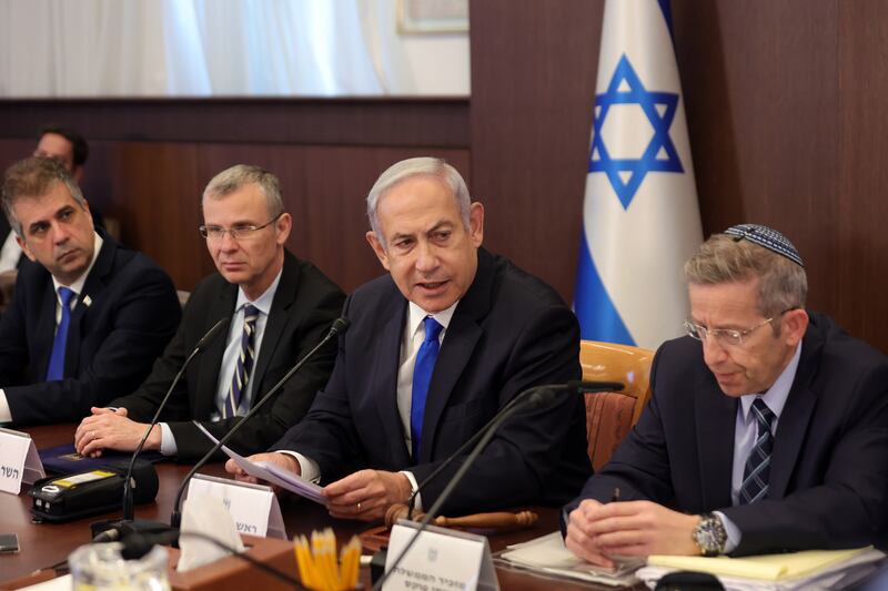 Israeli Prime Minister Benjamin Netanyahu (second from right), flanked by Deputy Prime Minister and Minister of Justice Yariv Levin (second from left), Foreign Minister Eli Cohen (left) and Cabinet Secretary Yossi Fuchs, attends cabinet meeting in Jerusalem on Sunday. EPA