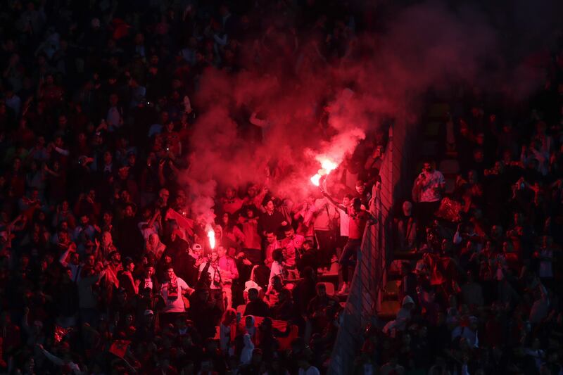 Morroco fans light flares during the match in Tangier. AP
