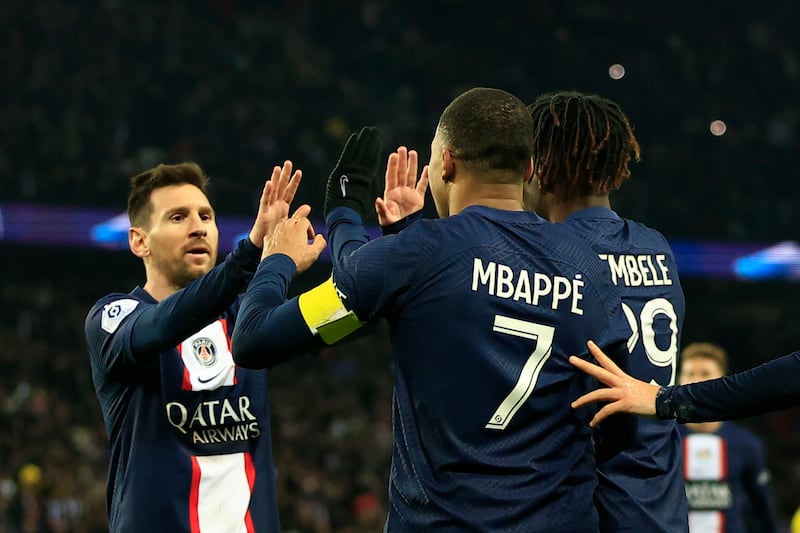 Lionel Messi congratulates Kylian Mbappe after the French forward scored PSG's fourth goal against Nantes. AP 