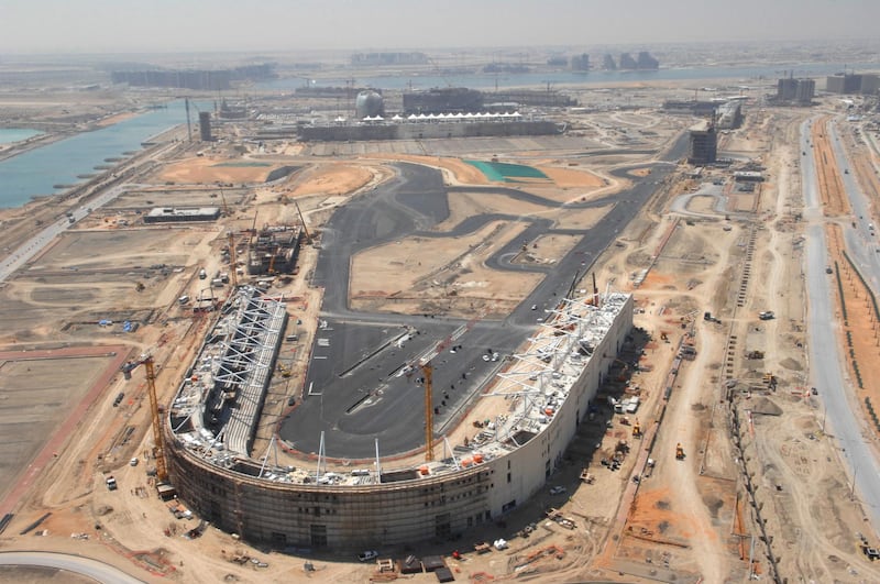 Seating stands rise out of the sand in 2009 at what will become turn seven of the Yas Marina Circuit.