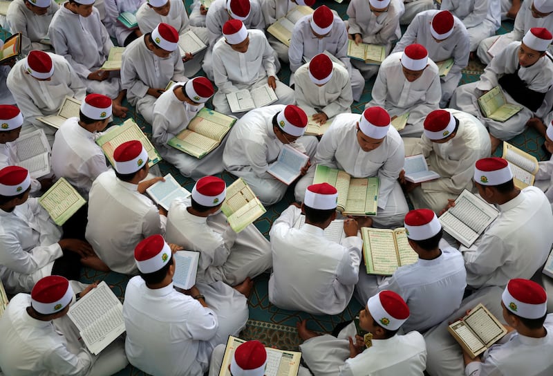 Students of an Islamic boarding school recite Quran in Kuala Lumpur, Malaysia. Reuters