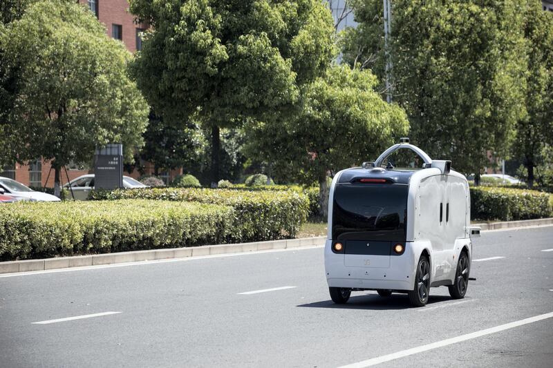A Neolix autonomous vehicle travels along a road during a test drive at the company's facility in Changzhou, Jiangsu province, China, on Friday, May 24, 2019. Chinese startup Neolix kicked off mass production of its autonomous vehicles Friday, and has lined up customers including online retailer JD.Com Inc. and gadget maker Huawei Technologies Co. Photographer: Giulia Marchi/Bloomberg