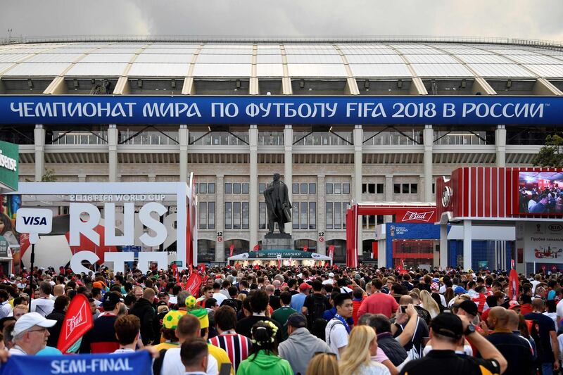 Fans gather near the statue of Soviet Union founder Vladimir Lenin outside the stadium before the semi-final. AFP