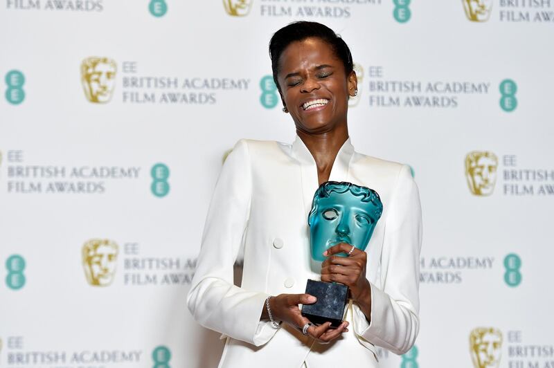 Letitia Wright poses with her Rising Star award in the press room during the Baftas. EPA