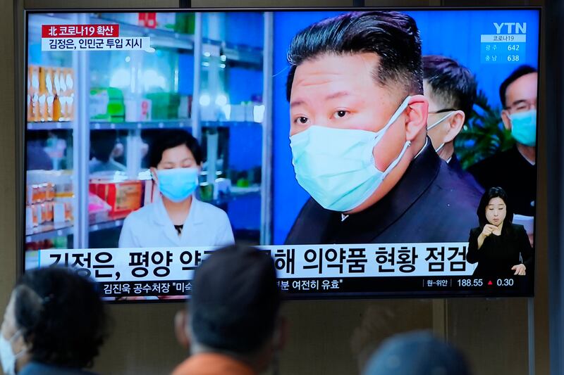 People at a train station in Seoul, South Korea, watch a news programme showing North Korean leader Kim Jong Un on May 16. AP