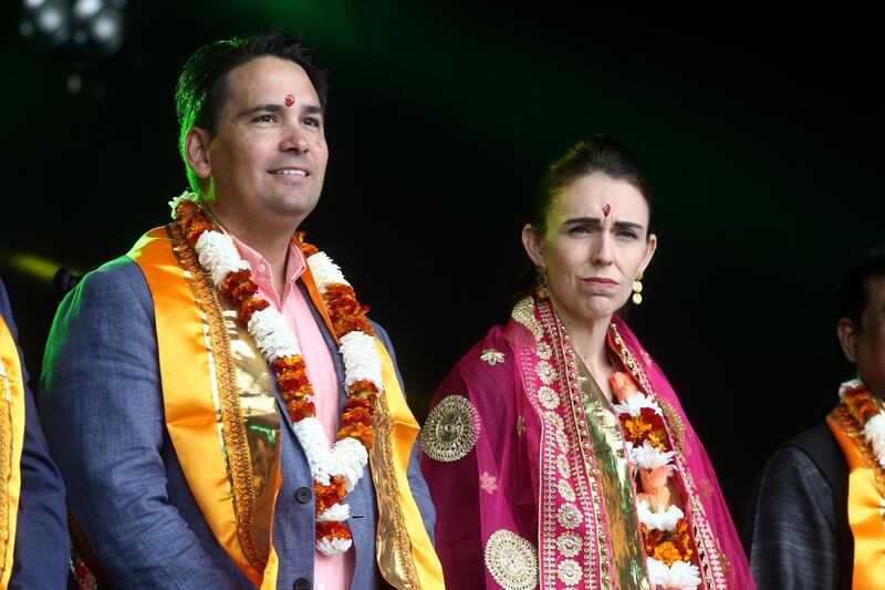 Opposing politicians: New Zealand Prime Minister Jacinda Ardern (R) and National Party leader Simon Bridges pictured on stage during the 18th Auckland Diwali Festival on October 12, 2019 in Auckland, New Zealand. Photo: Phil Walter / Getty Images