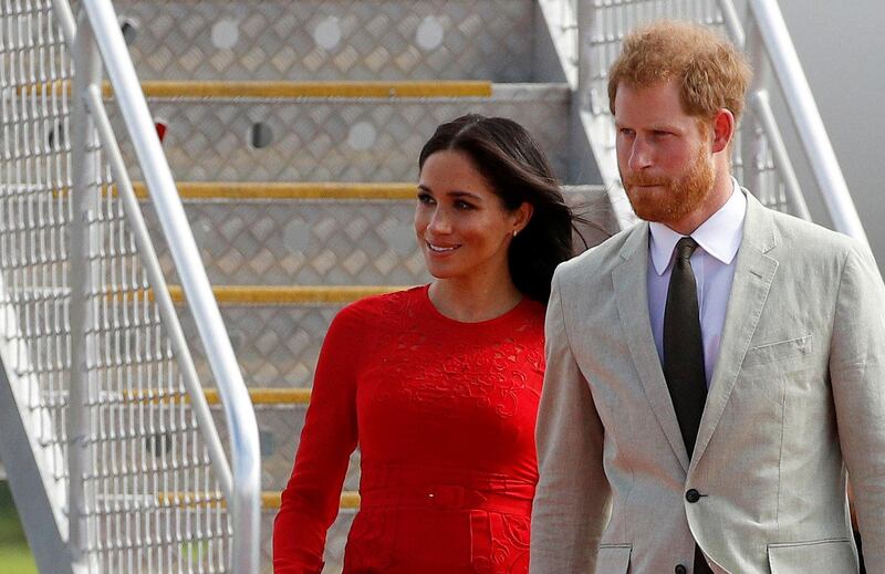 Britain's Prince Harry and Meghan, Duchess of Sussex, arrive at Fua'amotu airport on the main island Tongatapu in Tonga. REUTERS