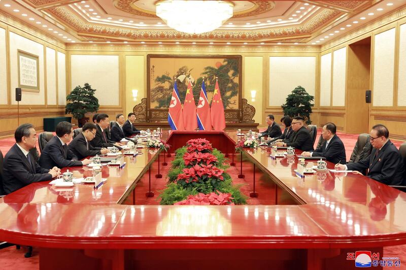The North Korean delegation and Chinese officials hold a meeting in Beijing.  KCNA / EPA