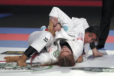 Shamma Yousef Alkalbani (red) on her way to victory over Brionii Cuskelly in the final of the 52KG category in the Abu Dhabi World Professional Jiu Jitsu Championship 2019 held at the Mubadala Arena in Abu Dhabi.  Pawan Singh / The National