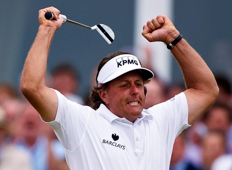 epa03796060 US golfer Phil Mickelson celebrates a birdie on 18th green during the British Open Golf Championship at Muirfield golf course in Gullane, Scotland, Britain on 20 July 2013.  EPA/KERIM OKTEN *** Local Caption ***  03796060.jpg