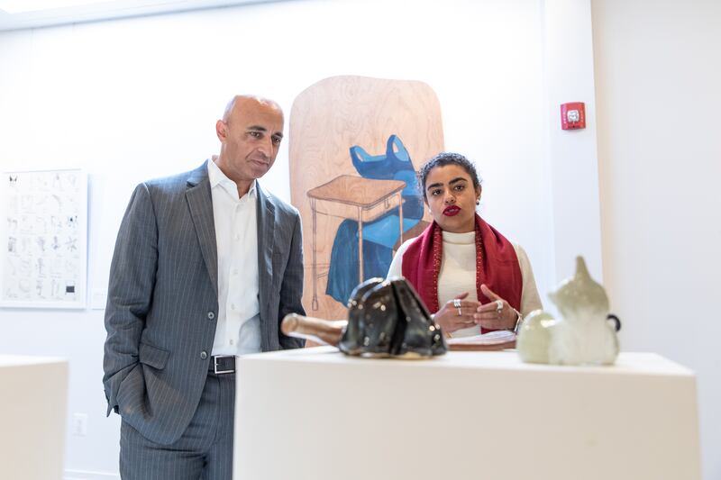 Mr Al Otaiba and exhibition curator Murina Al Sayegh.